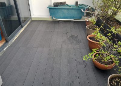 WPC deck floor with flower pots, angled view