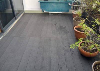 WPC deck floor installed with flower pots on top