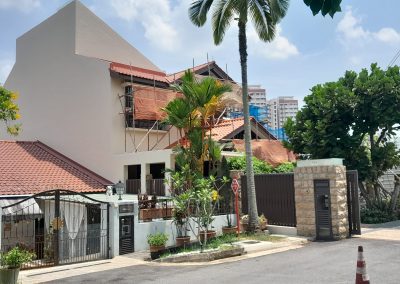 Major roof and painting renovation work in progress at a house in a residential area